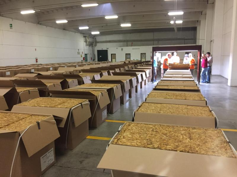 Bulk tobacco cartons arranged for inspection before large order approval
