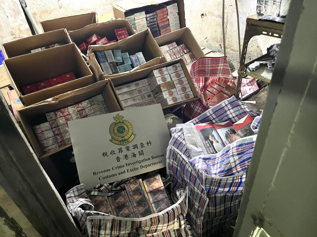 Customs photo showing seized suspected illicit cigarette cartons in a storage location as a real-world red-flag example